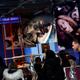 Shoppers walk past images of pop star Beyonce at an Adidas store